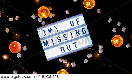 Lightbox With Text Jomo Joy Of Missing Out. The Concept Of Relaxation From Information And Gadgets. 