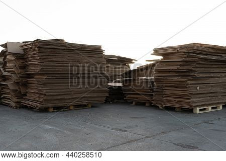 Photo Of A Large Quantity Of Cardboard In A Paper Processing Plant. High Quality Photo