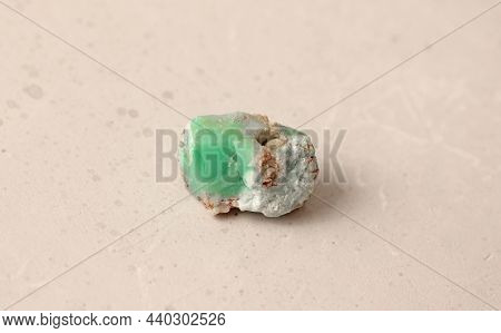 Natural Chrysoprase Stone Lies Is On A Light Background. Natural Stones, Crystals For Magic, Lithoth