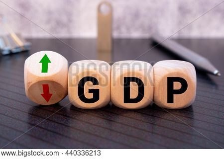 Gdp, Gross Domestic Product Symbol. Wooden Cubes With Up And Down Icon. Word 'gdp'. Beautiful Orange