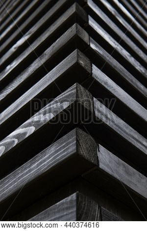 Black Horizontal Wooden Bars. Side View Of A Decorative Wall. The Corner Of The Gazebo. Vertical Ori