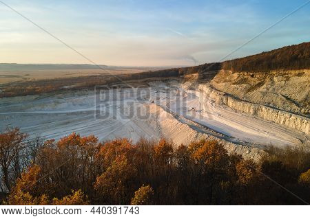 Aerial View Of Open Pit Mine Of Sandstone Materials For Construction Industry With Excavators And Du