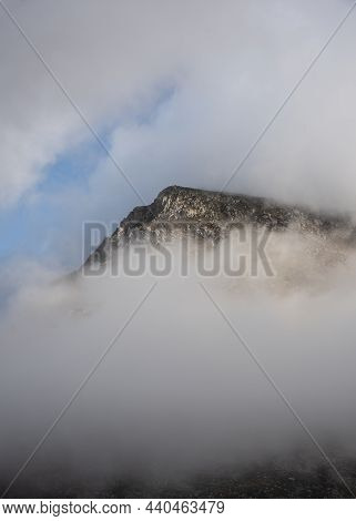 Epic Mountain Landscape Image Of Pen Yr Ole Wen In Snowdonia National Park With Low Cloud On Peak An