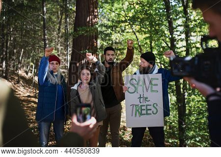 Diverse Group Of Environmental Activists With Banner Protestig Against Illegal Construcion In Forest