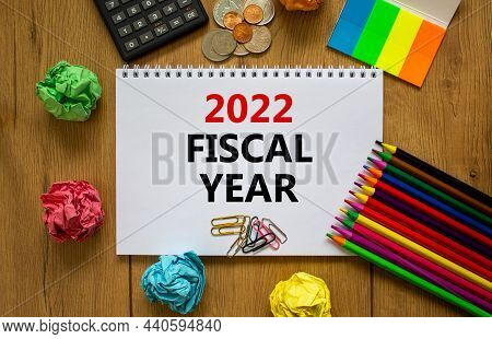 2022 Fiscal New Year Symbol. White Note, Words 2022 Fiscal Year On Beautiful Wooden Table, Colored P