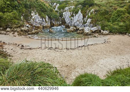 Picturesque Inlet Sand And Rocky Beach In Asturias, Gulpiyuri. Spain