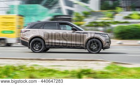 Range Rover Velar Test Drive At The City Streets. Premium Suv Car Driving On Urban Highway With Moti