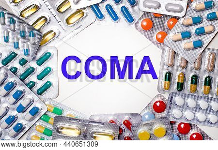 Senior Man In A Coma Laying On Hospital Bed And His Wife Sitting Next To Him