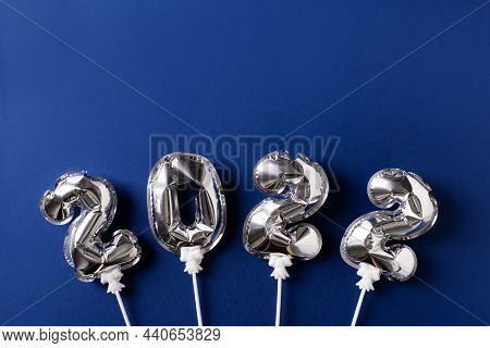 New Year Ccard Flat Lay With Silver Number Balloon, Celebration Dark Blue Background