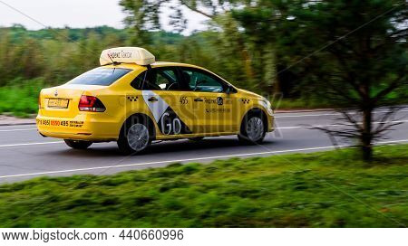 Yandex Go Taxi Rides On Country Road. Overspeed Out Of City Concept. Yellow Cab In Motion. Moscow, R