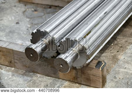 The Spline Shaft After Cnc Milling Lies In The Warehouse On A Rack.