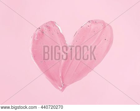 Liquid Gel Cosmetic Smudge Texture In Heart Shape On Pink Background. Aesthetic Beautiful Textured S