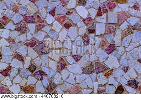 A Colorful Mosaic Of Small Irregular Stones. Texture Or Background