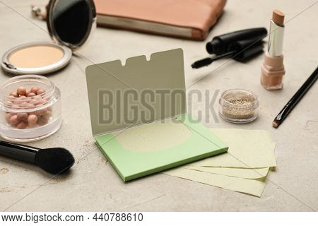 Facial Oil Blotting Tissues And Different Decorative Cosmetics On Light Grey Background. Mattifying 