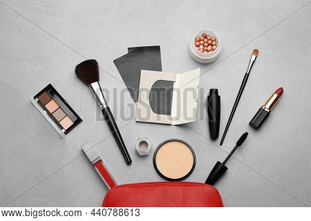 Facial Oil Blotting Tissues And Different Decorative Cosmetics On Light Grey Background, Flat Lay. M