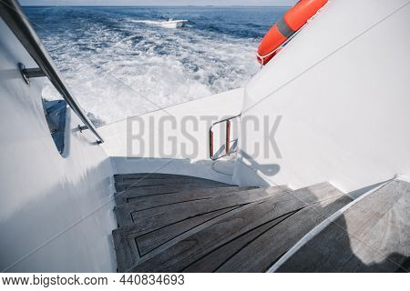 Wide-angle Shot Of A Luxurious Boat Stern Of The Wake (wash) Effect On The Water From The Motor On T