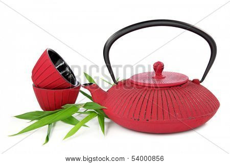 Traditional Japanese teapot and cups isolated on white background