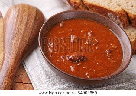 Bowl with goulash soup