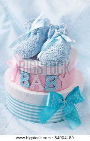 Little baby booties and gift boxes