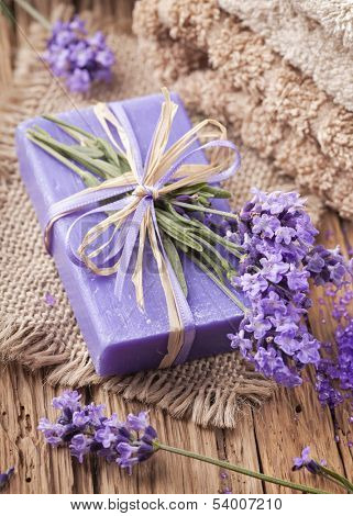Lavender spa treatment on wooden background