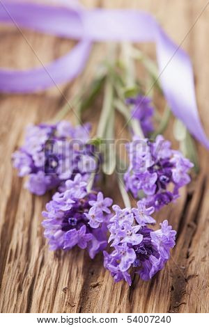 Lavender flowers on a wooden background