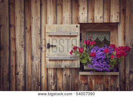 Old wooden window with shutters