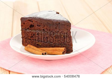 Chocolate sacher cake on wooden table