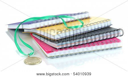 Medal for achievement in education and notebooks isolated on white