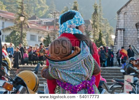 Hmong Woman Carrying Her Child In Her Backpack. Sapa. Vietnam