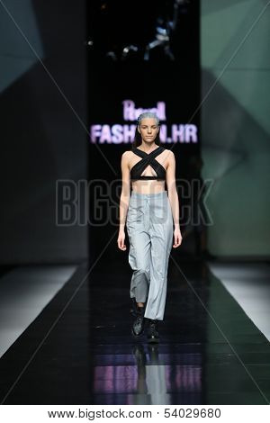 ZAGREB, CROATIA - OCTOBER 17: Fashion model wearing clothes designed by Petra Vuletic and Sasa Hortig on the 'Fashion.hr' show on October 17, 2013 in Zagreb, Croatia.