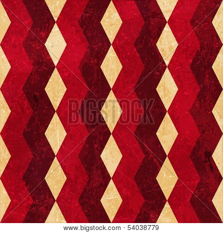 Geometric pattern made of rhombuses in various bright reds and beige colors overlaid with grunge elements and scratches to give it an aged and distressed feeling.
