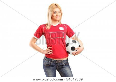 A portrait a blond female fan holding a football isolated on white background