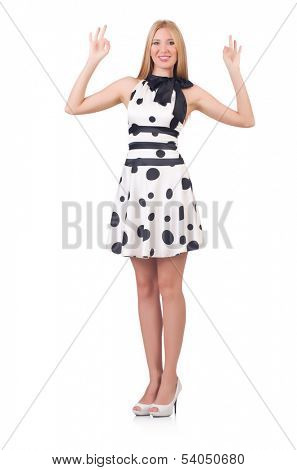 Tall model dressed in dress with polka dosts on white