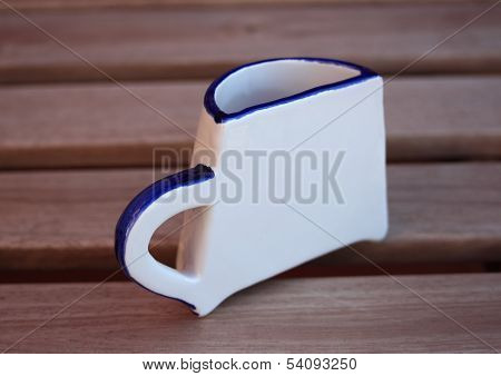 Half a Cup on a teak bench