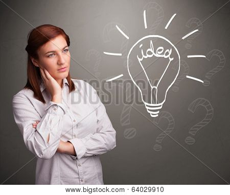 Pretty young girl comming up with a light bubl idea sign