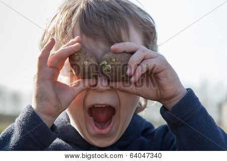 Portrait Of Boy With Potatoes