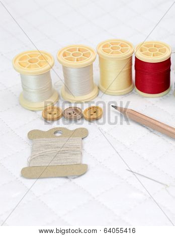 Needlework accessories put on Patchwork Quilt