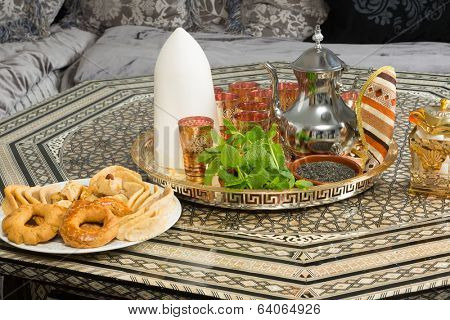 Traditional heavy Moroccan Sugar Cone or Qalib Sukar and tea tray with Ramadan cookies - sugar cones are gifts to mark the birth of babies, weddings or to pay condolences