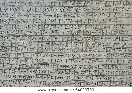 Background image of cuneiform script