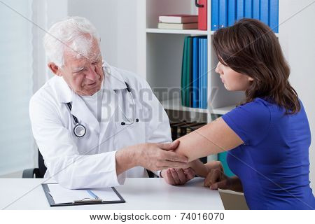 Orthopaedist Diagnosing Painful Elbow
