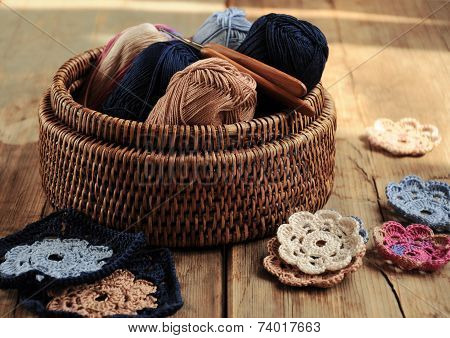 Box Of Yarn And Crocheted Flowers