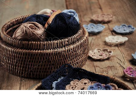Box Of Yarn And Crocheted Flowers
