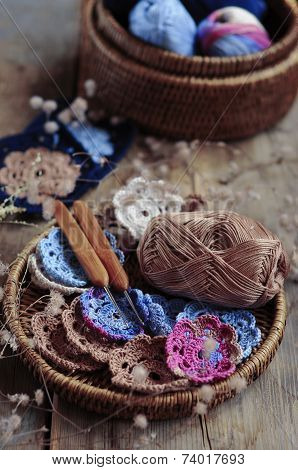 Box Of Yarn And Crocheted Flowers