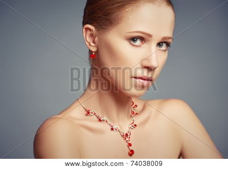 beauty girl with red jewelry necklace and earrings