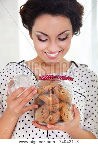 Happy Woman Holding Jar With Coockies In Her Kitchen