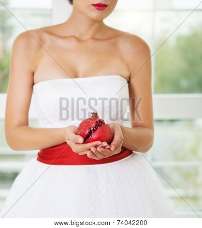 Pomegranat In Hands Of A Bride