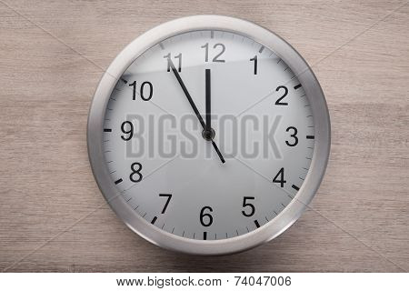 Clock Showing Five Before Noon