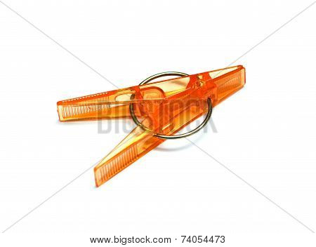 plastic clothespins with metal spring isolated on a white background