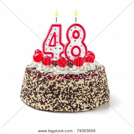 Birthday cake with burning candle number 48