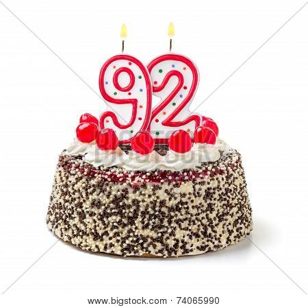 Birthday cake with burning candle number 92